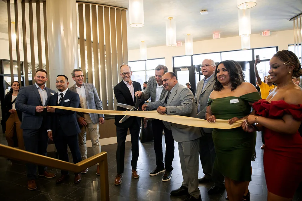 Stakeholders gather to celebrate the grand opening of Lucca Fox Valley Apartments in Aurora